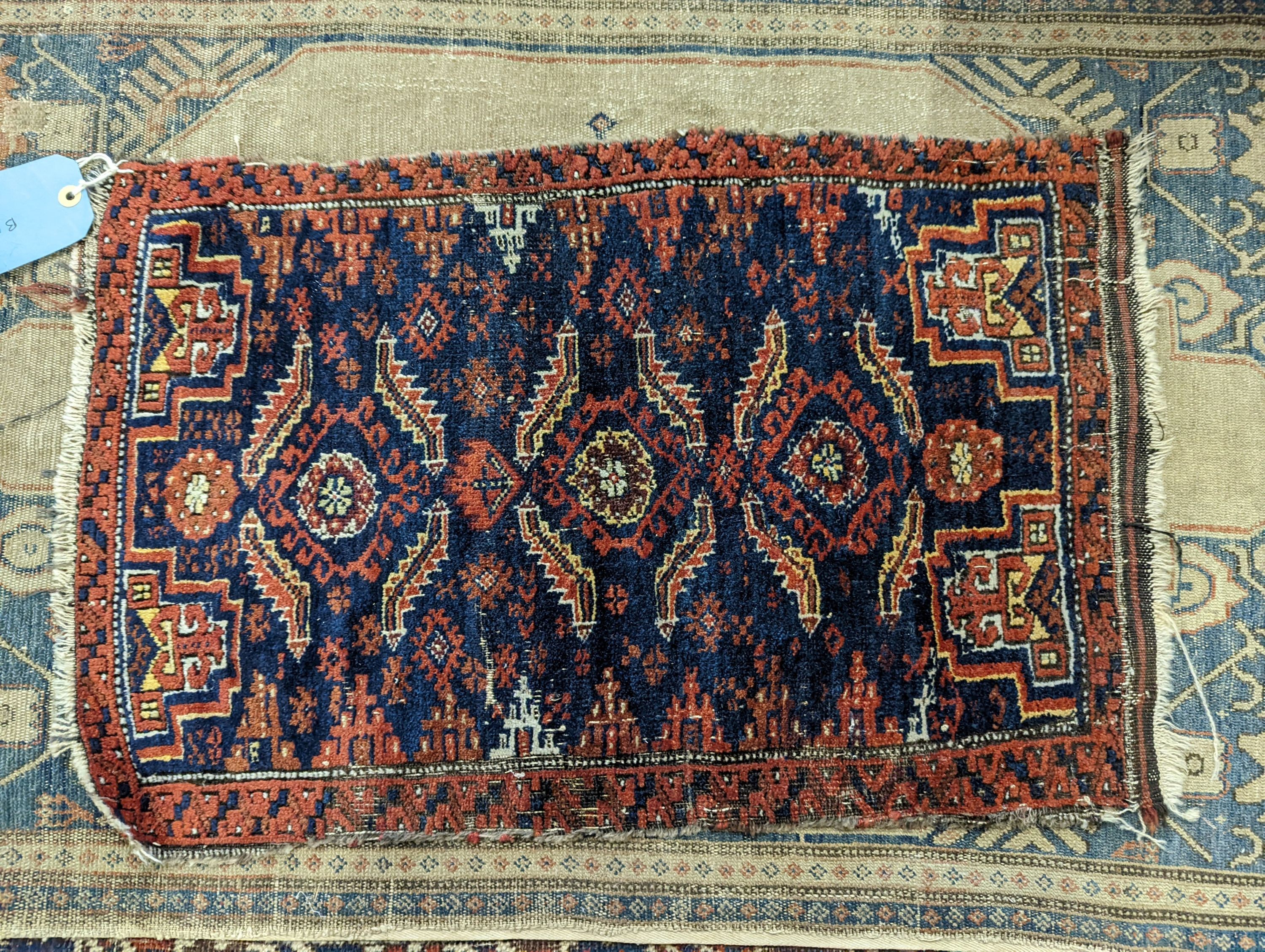 An antique Kuba rug, 118 x 84cm, a Kurdistan bag face, a Belouch bag face and two small rugs